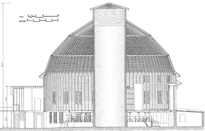 A dimensioned line drawing section of a round barn showing its radial roof framing and center silo.